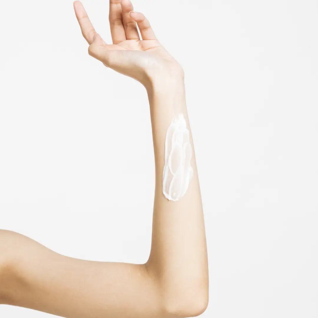 Woman arm with lotion
