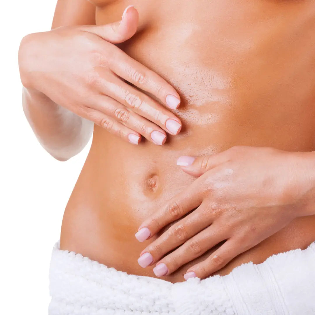 Close-up of a woman's torso with hands on a white background