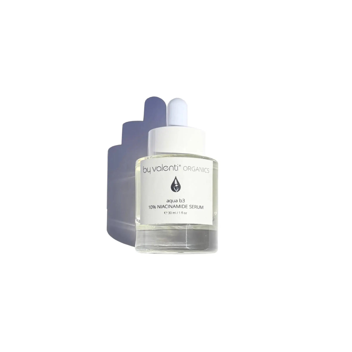 A clear glass dropper bottle of by valenti organics 10% Niacinamide Serum, featuring a white label and white dropper cap, set against a plain white background with a soft shadow cast to the left.