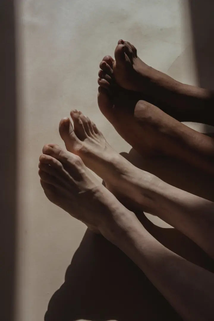 Close-up of feet with a neutral background