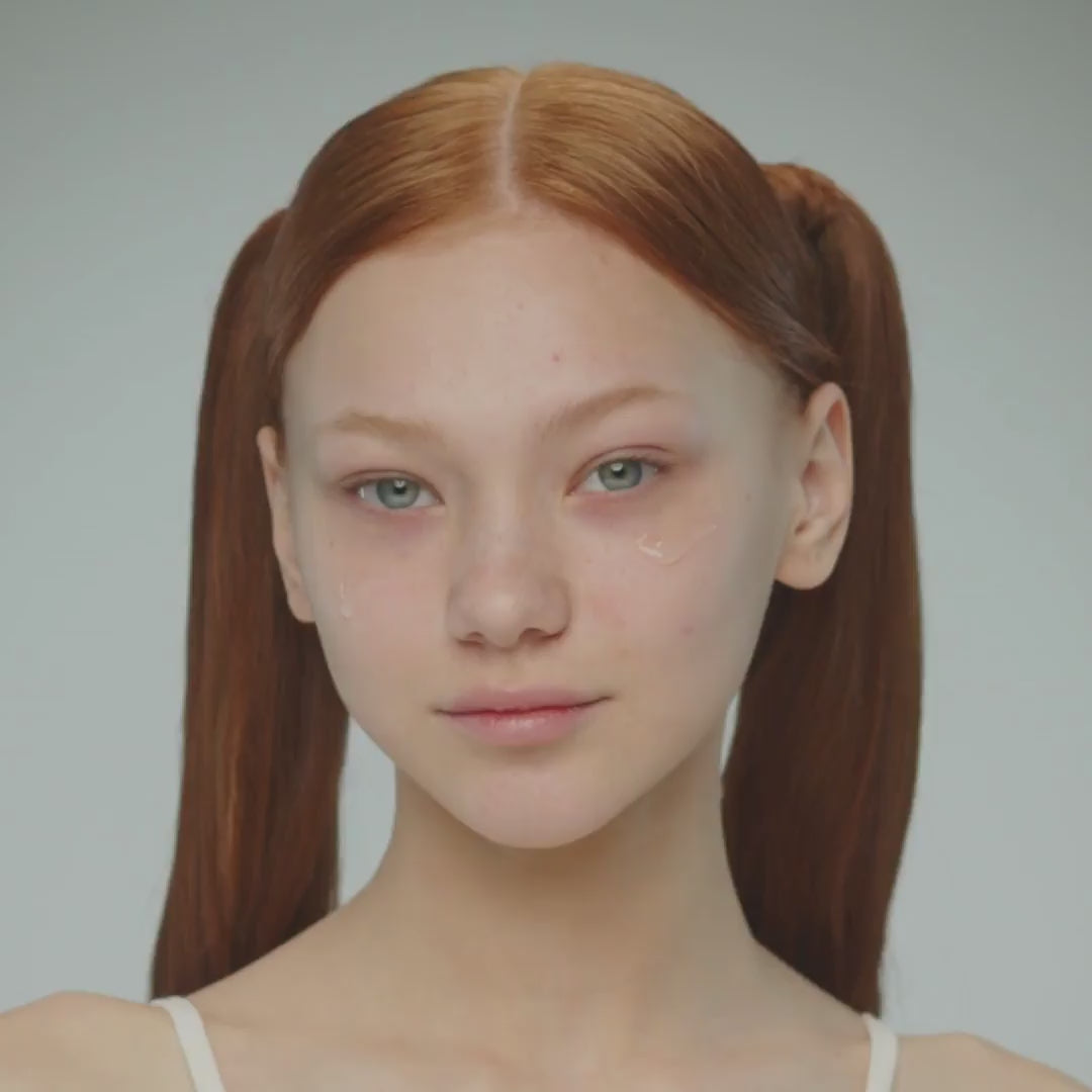 Video of young woman with red hair in two pony tails and blue eyes, applying By Valenti Aqua B3 10% niacinamide serum on her face, showcasing clear clean skin.